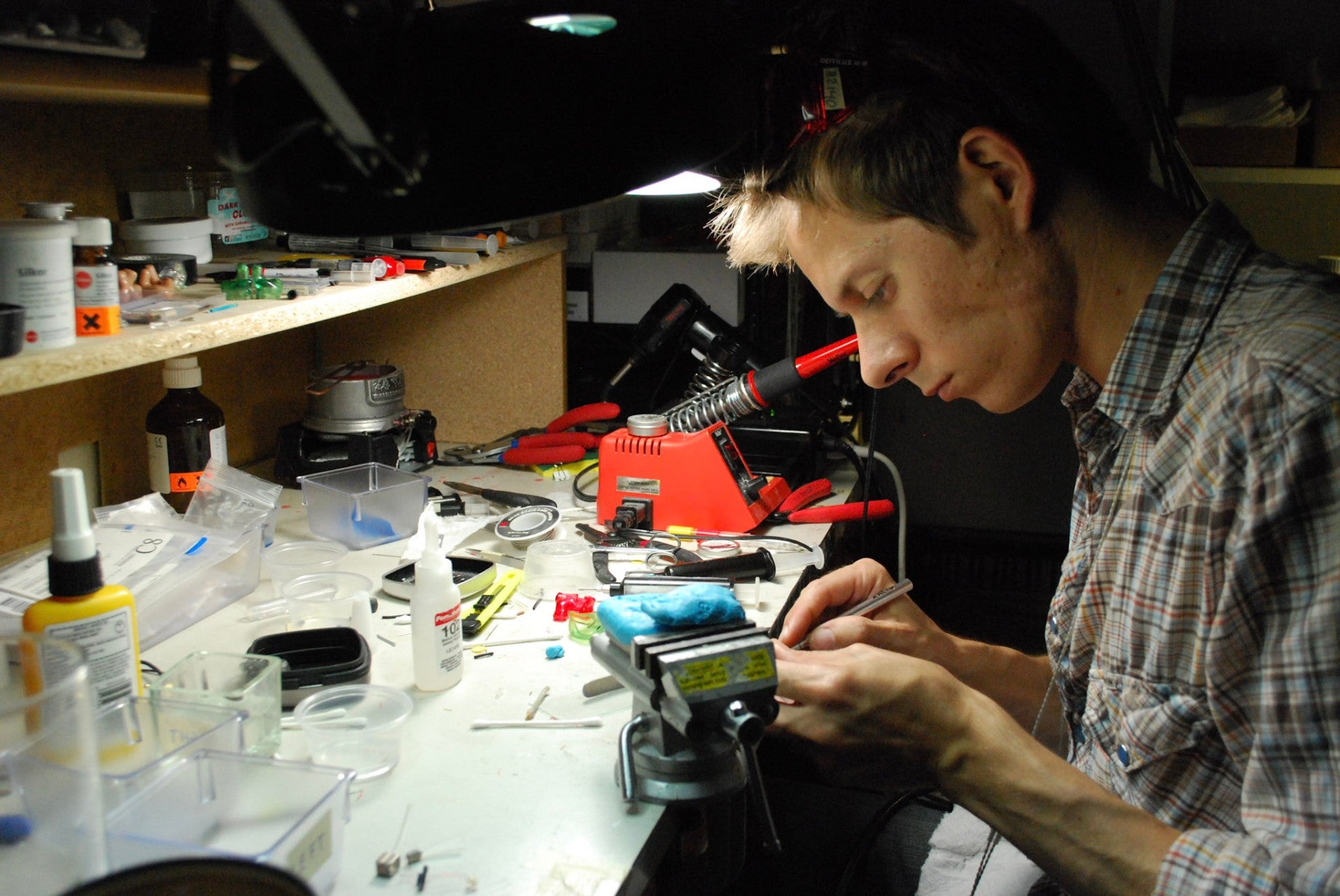 Craftsman working on audio equipment